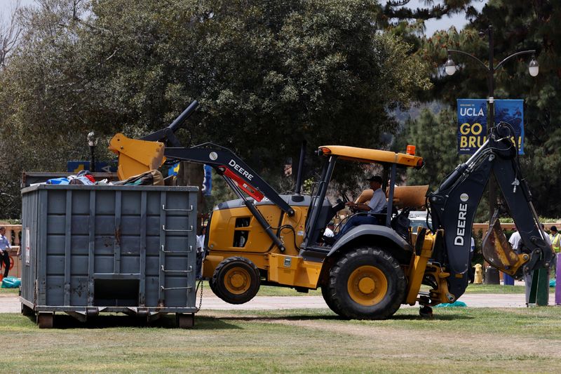 &copy; Reuters. A person operating a bulldozer removes the remnants of a protest encampment in support of Palestinians, that was broken down by police the previous night on the campus of University of California Los Angeles (UCLA), in Los Angeles, California, U.S., May 2