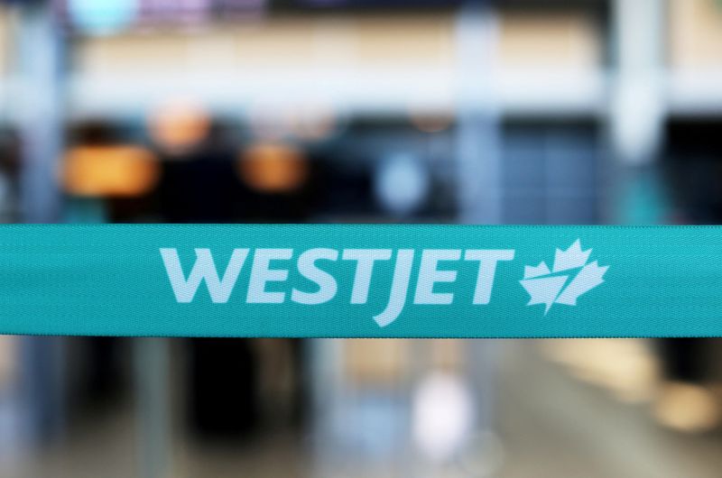 &copy; Reuters. FILE PHOTO: WestJet airline signage is pictured at Vancouver's international airport in Richmond, British Columbia, Canada, February 5, 2019.  REUTERS/Ben Nelms/File Photo