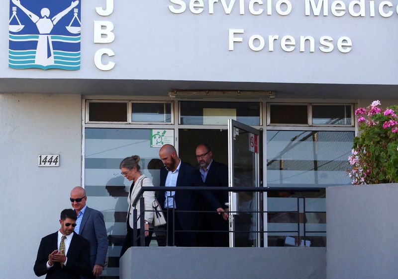 © Reuters. Members of the United States and Australian embassies and the parents of missing U.S. and Australian tourists leave the Forensic Medical Service (Servicio Medico Forense) after the parents identified that the three bodies found earlier are their children's, in Ensenada, Mexico, May 5, 2024. REUTERS/Jorge Duenes