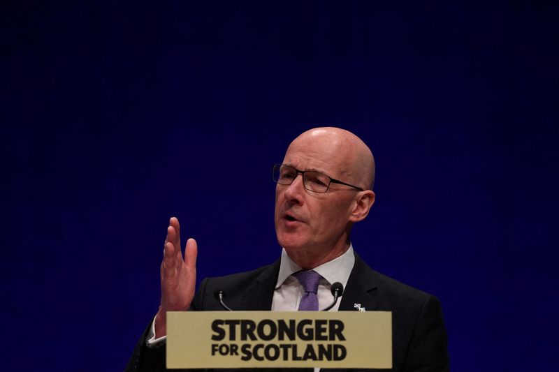 &copy; Reuters. FILE PHOTO: John Swinney speaks at the SNP Annual National Conference in Aberdeen, Scotland, Britain October 9, 2022. REUTERS/Russell Cheyne/File Photo