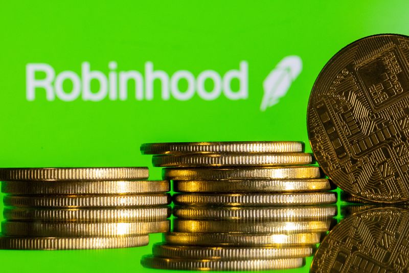 &copy; Reuters. Robinhood logo and representations of cryptocurrency are seen in this illustration taken December 12, 2023. REUTERS/Dado Ruvic/Illustration