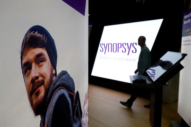 &copy; Reuters. FILE PHOTO: A man walks through the Synopsys booth during the Black Hat information security conference in Las Vegas, Nevada, U.S. on July 26, 2017. REUTERS/Steve Marcus//File Photo