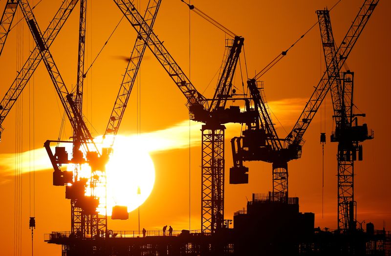 &copy; Reuters. Workers are seen as the sun sets behind a construction site in London, Britain, January 21, 2020. REUTERS/Henry Nicholls/File Photo