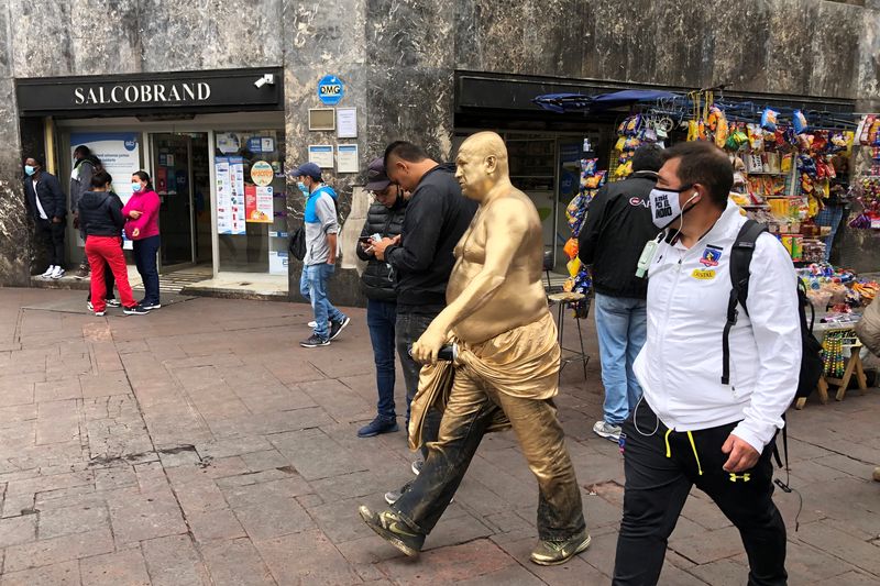 &copy; Reuters. A man covered in gold paint walks in a pedestrian area in downtown Santiago, Chile, February 16, 2021. REUTERS/Ivan Alvarado/File Photo