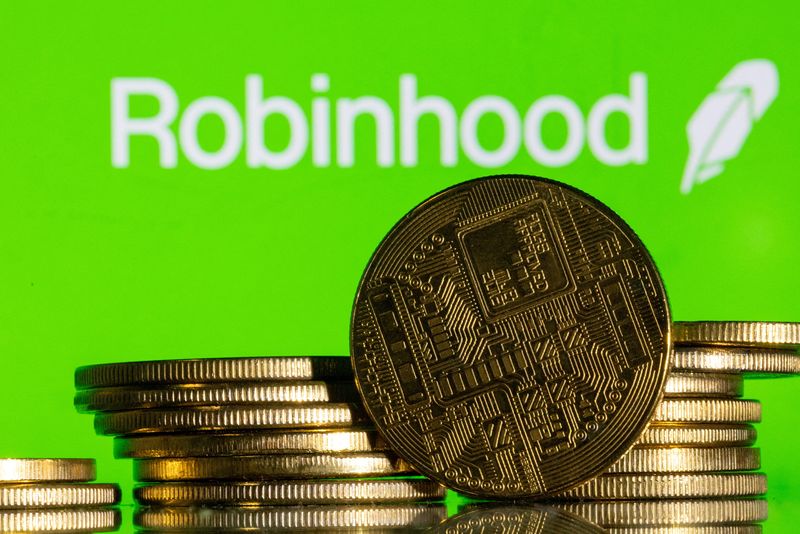 &copy; Reuters. FILE PHOTO: Robinhood logo and representations of cryptocurrency are seen in this illustration taken December 12, 2023. REUTERS/Dado Ruvic/Illustration/File Photo