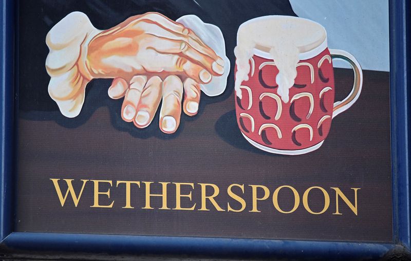 &copy; Reuters. FILE PHOTO: A Wetherspoon's logo is seen at a pub in central London, Britain, January 23, 2019. REUTERS/Toby Melville/File Photo