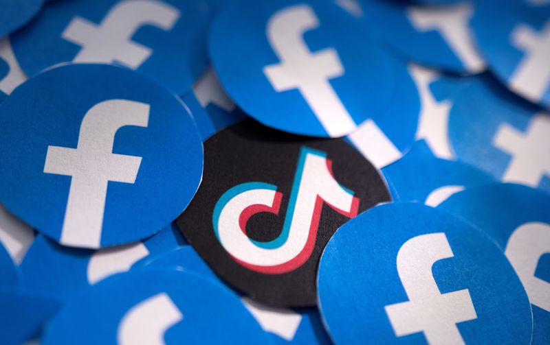 &copy; Reuters. FILE PHOTO: Printed Facebook and TikTok logos are seen in this illustration taken February 15, 2022. REUTERS/Dado Ruvic/Illustration/File Photo