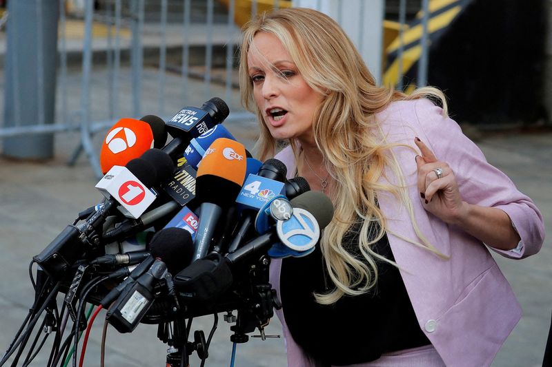 © Reuters. FILE PHOTO: Adult-film actress Stephanie Clifford, also known as Stormy Daniels, speaks as she departs federal court in the Manhattan borough of New York City, New York, U.S., April 16, 2018. REUTERSLucas Jackson/File Photo