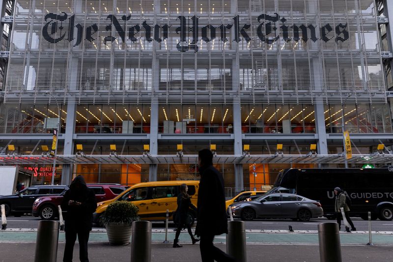 &copy; Reuters. FILE PHOTO: Pedestrians walk by the New York Times building in Manhattan, New York, U.S., December 8, 2022.  REUTERS/Jeenah Moon/File Photo