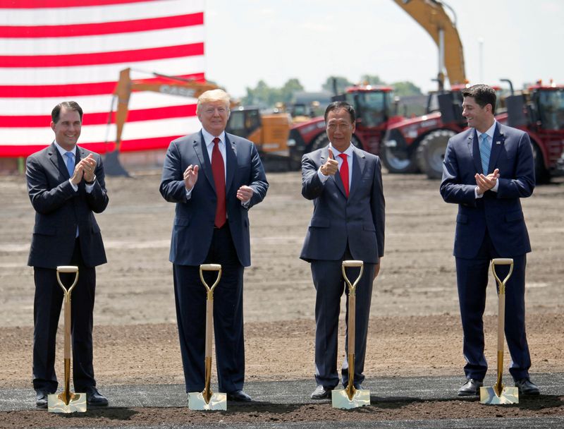 © Reuters. FILE PHOTO: President Donald Trump, along with Terry Gou, founder and chairman of Foxconn, Wisconsin Governor Scott Walker, and Speaker of the House Paul Ryan participate in the Foxconn Technology Group groundbreaking ceremony for its LCD manufacturing campus, in Mount Pleasant, Wisconsin, U.S., June 28, 2018. REUTERS/Darren Hauck/File Photo
