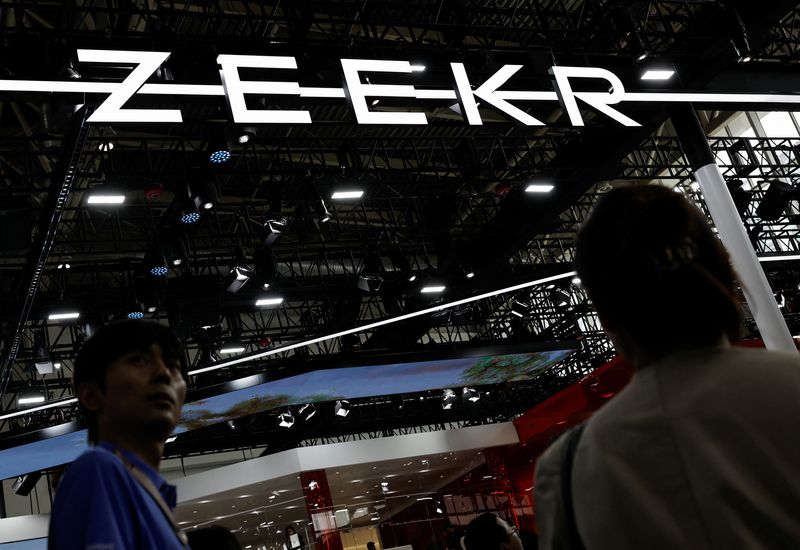 &copy; Reuters. FILE PHOTO: Visitors walk past the Zeekr logo, at the Beijing International Automotive Exhibition, or Auto China 2024, in Beijing, China, April 25, 2024. REUTERS/Tingshu Wang//File photo