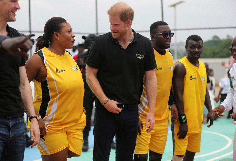 &copy; Reuters. Britain's Prince Harry, Duke of Sussex speaks with people on the day he attends a volleyball match played with wounded army veterans, at the Nigerian army officers' mess in Abuja, Nigeria May 11, 2024. REUTERS/Akintunde Akinleye