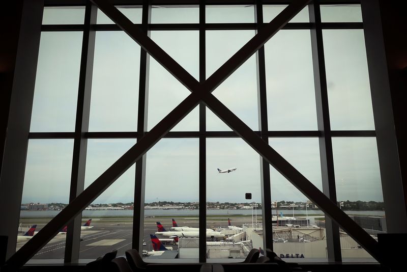 &copy; Reuters. FILE PHOTO: A plane takes off as seen from inside the newly completed 1.3 million-square foot $4 billion Delta Airlines Terminal C at LaGuardia Airport in the Queens borough of New York City, New York, U.S., June 1, 2022. REUTERS/Mike Segar/File Photo