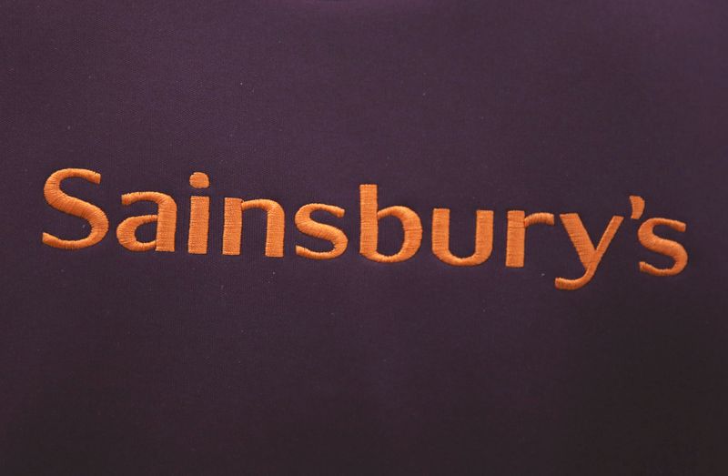 &copy; Reuters. A worker's uniform displays company branding at a Sainsbury's store in London, Britain October 11, 2016. REUTERS/Neil Hall/File Photo