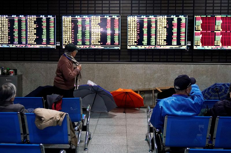 &copy; Reuters. Investors look at screens showing stock information at a brokerage house in Shanghai, China January 16, 2020. REUTERS/Aly Song/Files