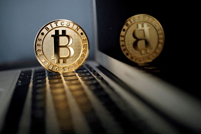 &copy; Reuters. FILE PHOTO: A bitcoin is seen in an illustration picture taken at La Maison du Bitcoin in Paris, France, June 23, 2017. REUTERS/Benoit Tessier/File Photo