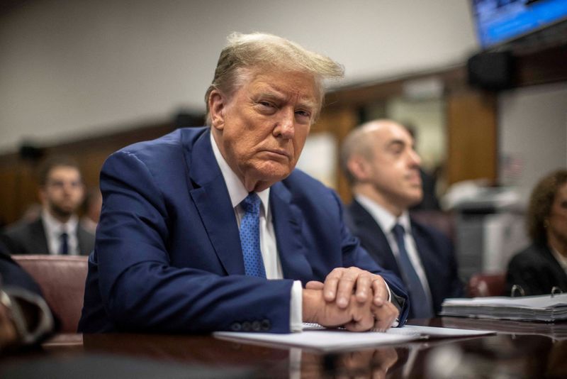 © Reuters. MAY 20, 2024 - NEW YORK, NY: Former President Donald Trump, charged with falsifying 34 business records in an attempt to cover up a payment to adult film actress Stormy Daniels, sits in a courtroom before the start of the day's proceedings in Manhattan Criminal Court, 100 Centre St. in Lower Manhattan, May 20, 2024.   Dave Sanders/Pool via REUTERS