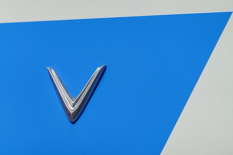 © Reuters. FILE PHOTO: A Vinfast electric vehicle logo is shown atop one of the company's retail locations in San Diego, California, U.S.,October 20, 2023.     REUTERS/Mike Blake/File Photo