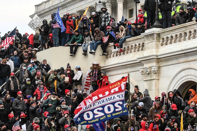 © Reuters. FILE PHOTO: Supporters of U.S. President Donald Trump gather at the west entrance of the Capitol during a protest outside of the Capitol building in Washington D.C. U.S., on January 6, 2021. REUTERS/Stephanie Keith/File Photo