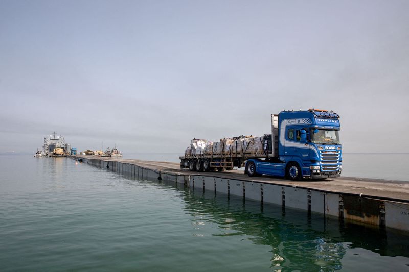 &copy; Reuters. FILE PHOTO: A truck carries humanitarian aid across Trident Pier, a temporary pier to deliver aid, off the Gaza Strip, amid the ongoing conflict between Israel and the Palestinian Islamist group Hamas, near the Gaza coast, May 19, 2024. U.S. Army Central/