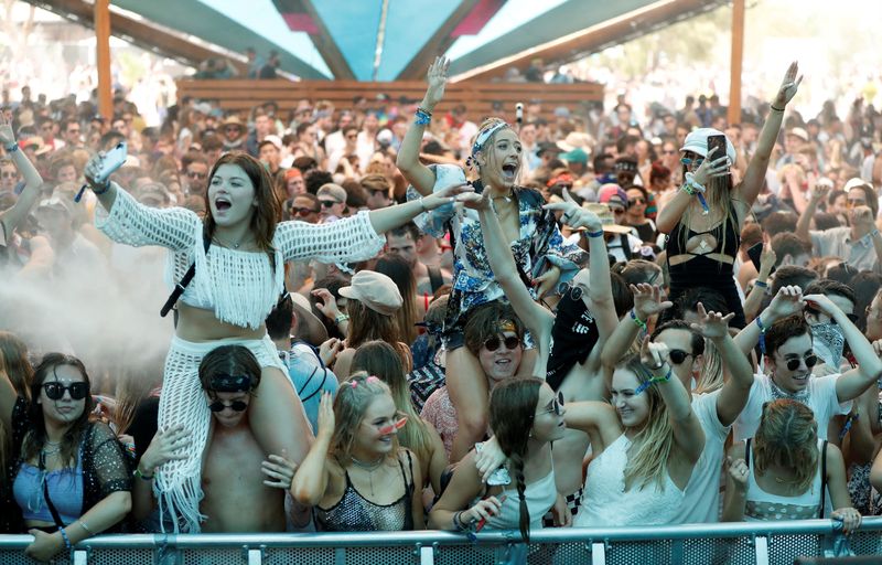 &copy; Reuters. FILE PHOTO: Concertgoers dance at the Do LaB stage at the Coachella Valley Music and Arts Festival in Indio, California, U.S., April 15, 2018.  REUTERS/Mario Anzuoni/File Photo