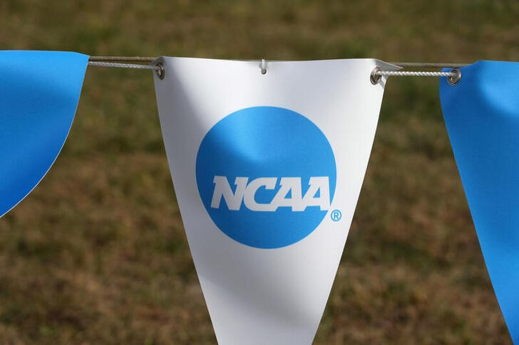 © Reuters. FILE PHOTO: Nov 17, 2023; Charlottesville, VA, USA; The NCAA logo on a banner at the NCAA cross country championships course at Panorama Farms. Mandatory Credit: Kirby Lee-USA TODAY Sports/File Photo