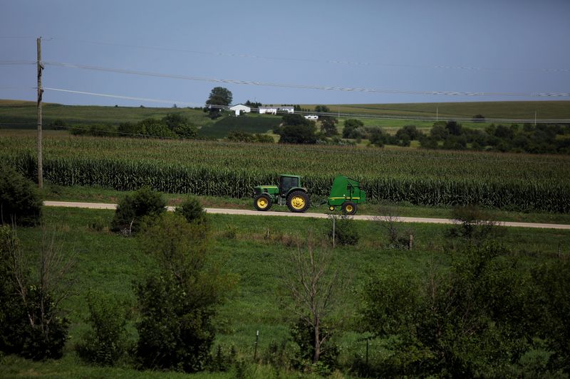 &copy; Reuters. A farmer drives tractor along a road in Pearl City, Illinois, U.S., July 25, 2018. Photo taken July 25, 2018. REUTERS/Joshua Lott/File Photo