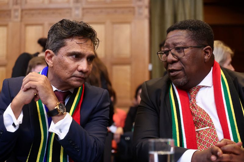 &copy; Reuters. FILE PHOTO: Director-General of the Department of International Relations and Cooperation of South Africa Zane Dangor and South African Ambassador to the Netherlands Vusimuzi Madonsela talk at the International Court of Justice (ICJ), at the start of a he