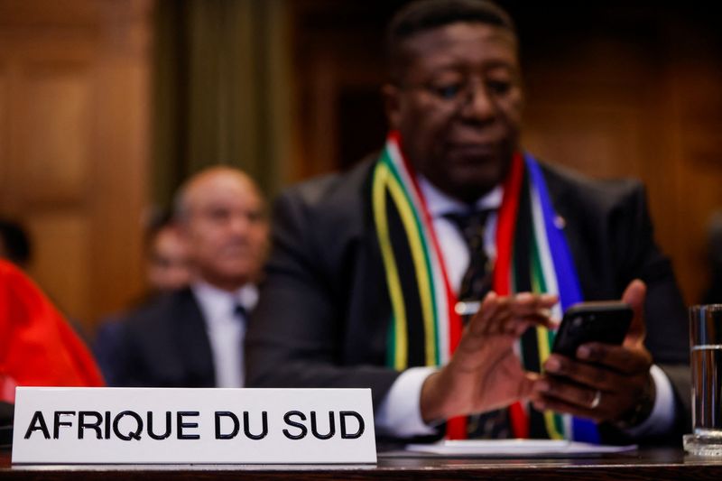 &copy; Reuters. South African Ambassador to the Netherlands Vusimuzi Madonsela uses a phone at the International Court of Justice (ICJ), during a ruling on South Africa's request to order a halt to Israel's Rafah offensive in Gaza as part of a larger case brought before 