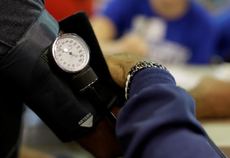&copy; Reuters. A man has his blood pressure checked at the Remote Area Medical Clinic in Wise, Virginia, U.S., July 22, 2017.   REUTERS/Joshua Roberts/File photo