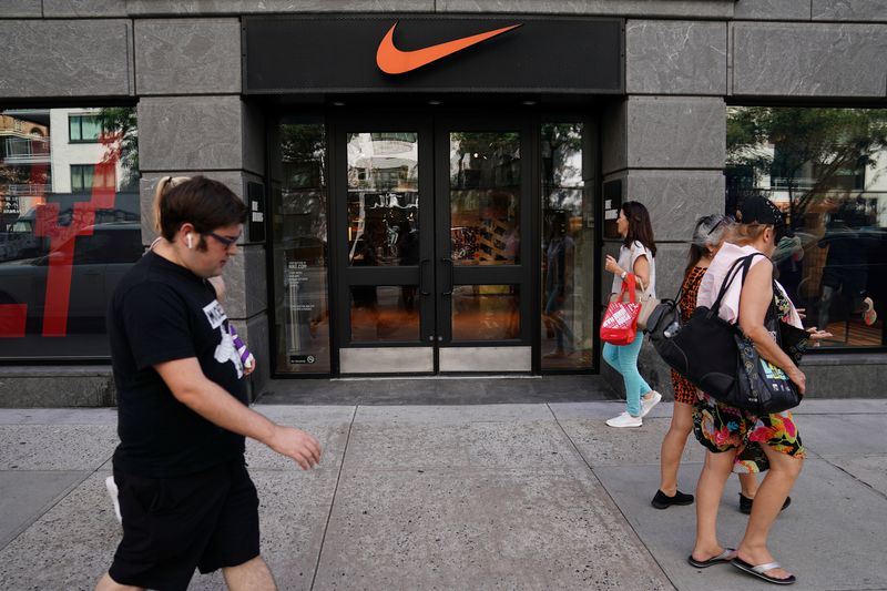 &copy; Reuters. People walk past a Nike store in New York City, New York, U.S., September 4, 2018. REUTERS/Carlo Allegri