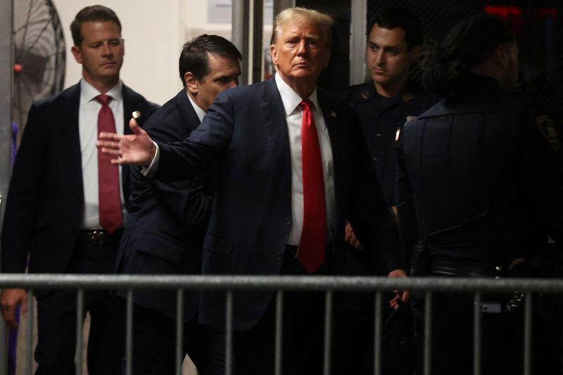 &copy; Reuters. Former U.S. President Donald Trump returns after a break in his criminal trial for allegedly covering up hush money payments at Manhattan Criminal Court on May 28, 2024 in New York City. Trump arrived for closing arguments in his hush money trial ahead of