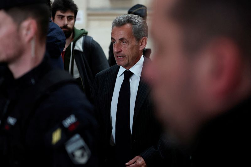 © Reuters. Former French President Nicolas Sarkozy arrives for the decision in his appeal trial in the 