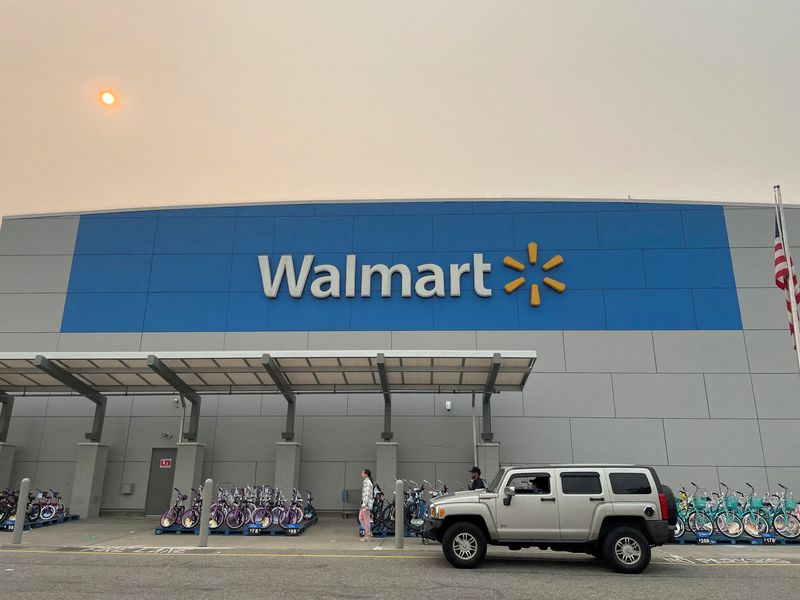 &copy; Reuters. FILE PHOTO: A shopper leaves a Walmart Supercenter in Secaucus, New Jersey, U.S., June 7, 2023. The store is one of its newly remodeled locations. REUTERS/Siddharth Cavale/File Photo