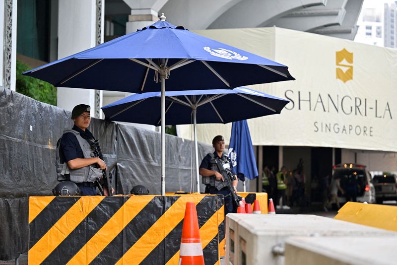 © Reuters. FILE PHOTO: Gurkhas stand guard at the entrance of the venue of the 20th Shangri-La Dialogue in Singapore June 2, 2023. REUTERS/Caroline Chia/File Photo