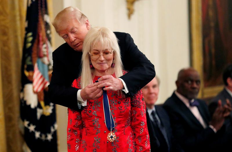 © Reuters. FILE PHOTO: U.S. President Donald Trump awards the 2018 Presidential Medal of Freedom to Miriam Adelson, the wife of Las Vegas Sands Corporation Chief Executive Sheldon Adelson and Republican mega donor in the East Room of the White House in Washington, U.S. November 16, 2018. REUTERS/Leah Millis/File Photo