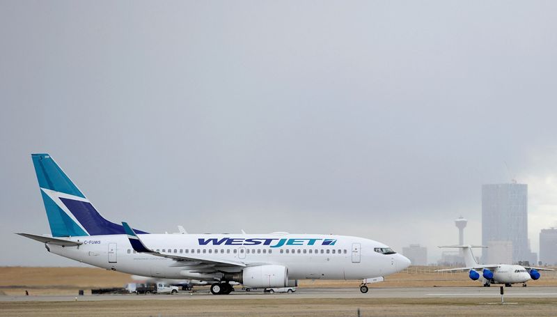 &copy; Reuters. FILE PHOTO: A Westjet Boeing 737-700 takes off at the International Airport in Calgary, Alberta, May 3, 2011. WestJet Airlines Ltd, Canada's No. 2 carrier, reported a 20-fold jump in quarterly earnings on Tuesday, lifting its stock, as fare increases intr