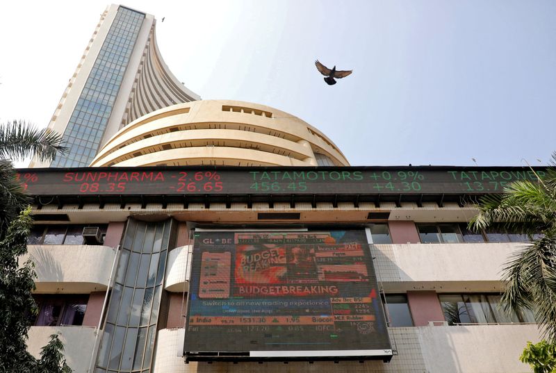 &copy; Reuters. FILE PHOTO: A bird flies past a screen displaying the Sensex results on the facade of the Bombay Stock Exchange (BSE) building in Mumbai, February 1, 2023. REUTERS/Niharika Kulkarni/File Photo