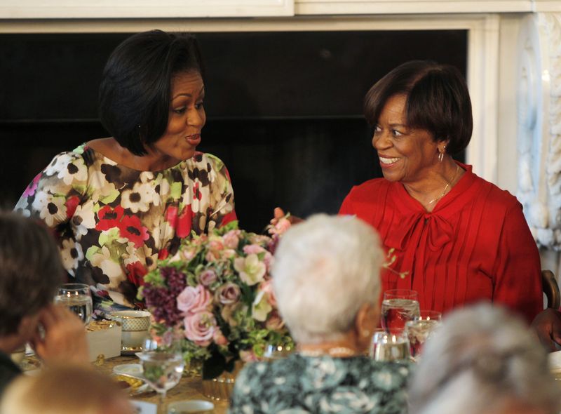 &copy; Reuters. FILE PHOTO: U.S. first lady Michelle Obama (L) sits alongside her mother Marian Robinson as she hosts a Mother's Day event in the State Dining Room of the White House in Washington May 7, 2010. REUTERS/Jason Reed/File Photo