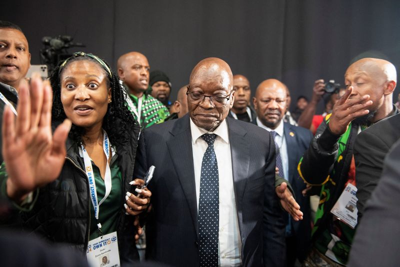 &copy; Reuters. South Africa's former President Jacob Zuma arrives with his daughter and member of uMkhonto weSizwe (MK) Duduzile Zuma at the National Results Operation Centre of the IEC, which serves as an operational hub where results of the national election are displ
