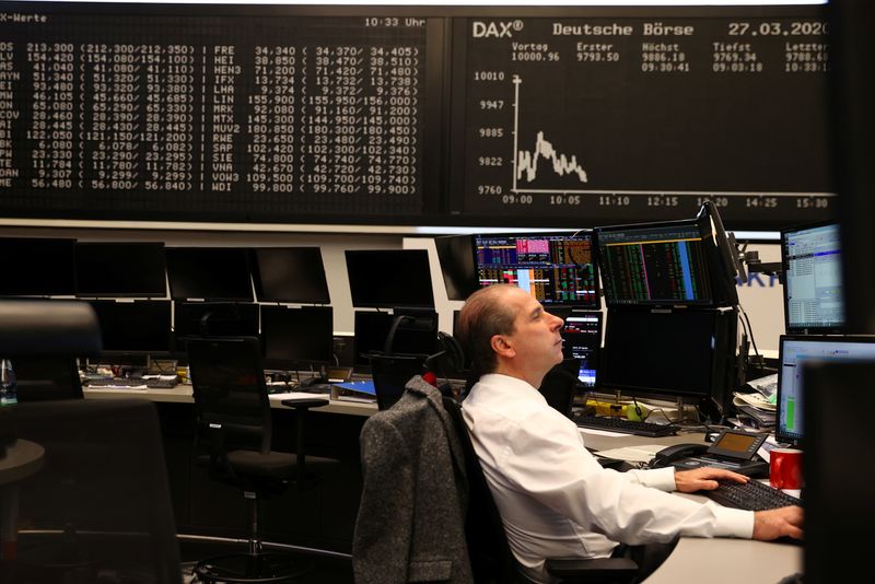 &copy; Reuters. FILE PHOTO: A stock broker works at Frankfurt's stock exchange as markets react on the coronavirus disease (COVID-19), at the stock exchange in Frankfurt, Germany, March 27, 2020. REUTERS/Kai Pfaffenbach/File photo