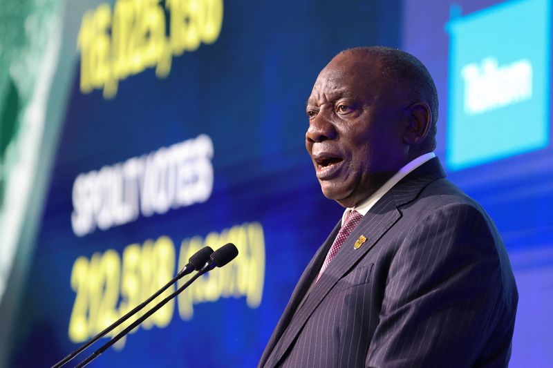 &copy; Reuters. FILE PHOTO: South African President Cyril Ramaphosa speaks as people attend the announcement of the election results at the National Results Operation Centre of the IEC, which serves as an operational hub where results of the national election are display