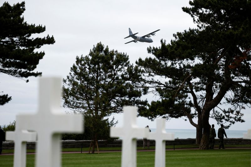 &copy; Reuters. A U.S. Air Force Lockheed Martin C-130 flies over headstones at the World War II Normandy American Cemetery and Memorial situated above Omaha Beach ahead of the 80th anniversary of the 1944 D-Day landings in Colleville-sur-Mer, Normandy region, France, Ju