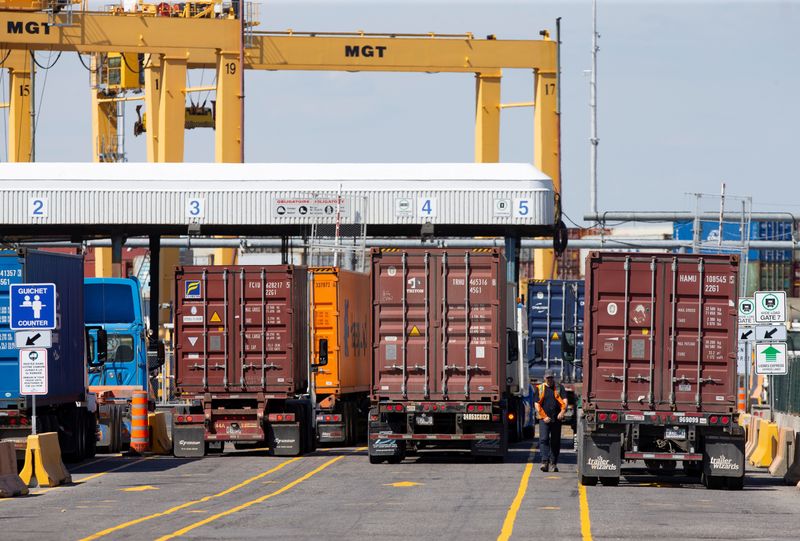 &copy; Reuters. Trucks loaded with shipping containers arrive at the Port of Montreal in Montreal, Quebec, Canada, May 17, 2021.  REUTERS/Christinne Muschi