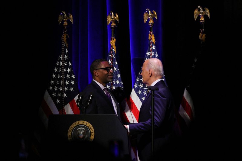 © Reuters. FILE PHOTO: U.S. President Joe Biden speaks with President and CEO of NAACP Derrick Johnson at the National Museum of African American History and Culture in Washington, U.S. May 17, 2024. REUTERS/Leah Millis/File Photo