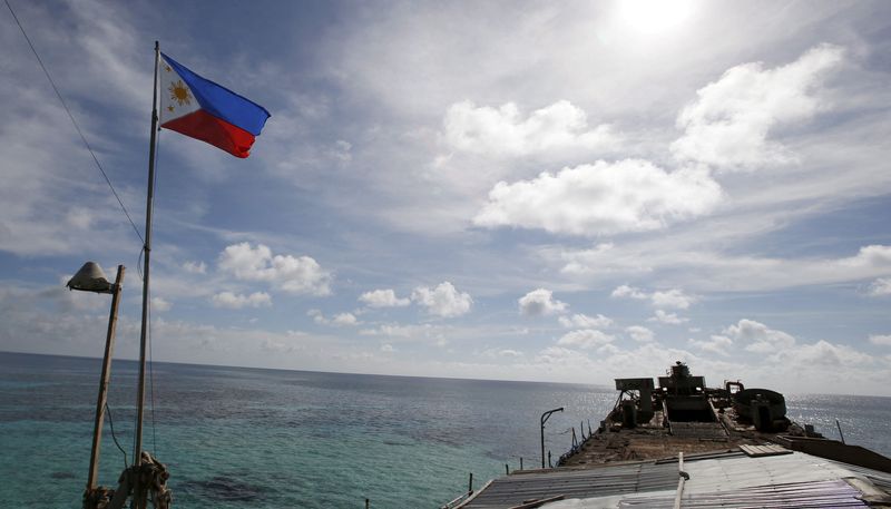 &copy; Reuters. FILE PHOTO: A Philippine flag flutters on BRP Sierra Madre, a dilapidated Philippine Navy ship that has been aground since 1999, on the disputed Second Thomas Shoal, part of the Spratly Islands, in the South China Sea March 29, 2014. REUTERS/Erik De Castr