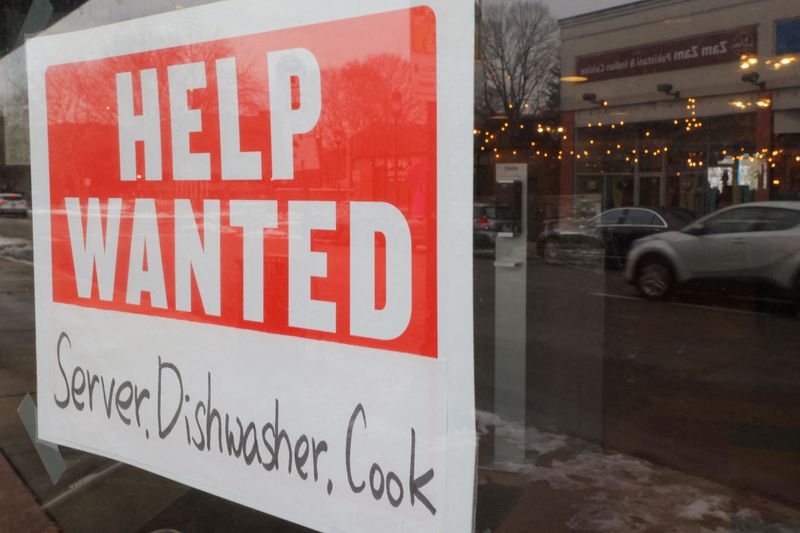 © Reuters. FILE PHOTO: A “Help Wanted” sign hangs in restaurant window in Medford, Massachusetts, U.S., January 25, 2023. REUTERS/Brian Snyder/File Photo