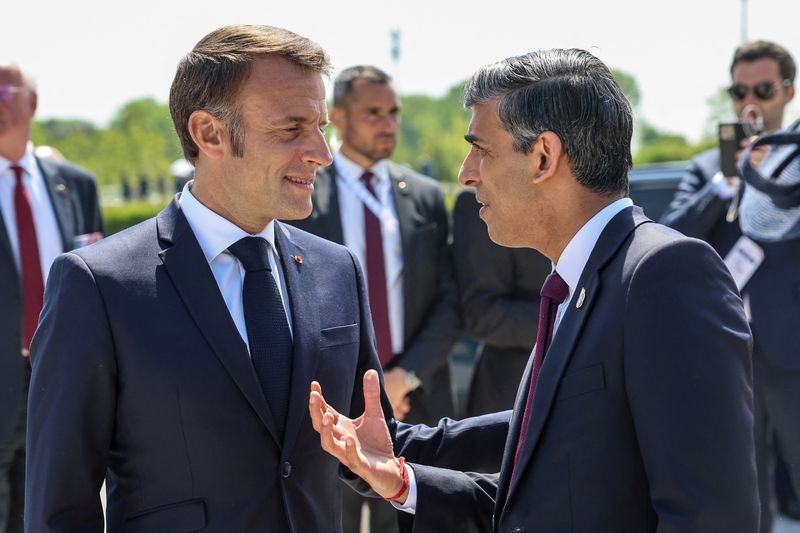 &copy; Reuters. FILE PHOTO: French President Emmanuel Macron and British Prime Minister Rishi Sunak attend the UK Ministry of Defence and the Royal British Legion's commemorative event at the British Normandy Memorial to mark the 80th anniversary of D-Day, in Ver-Sur-Mer