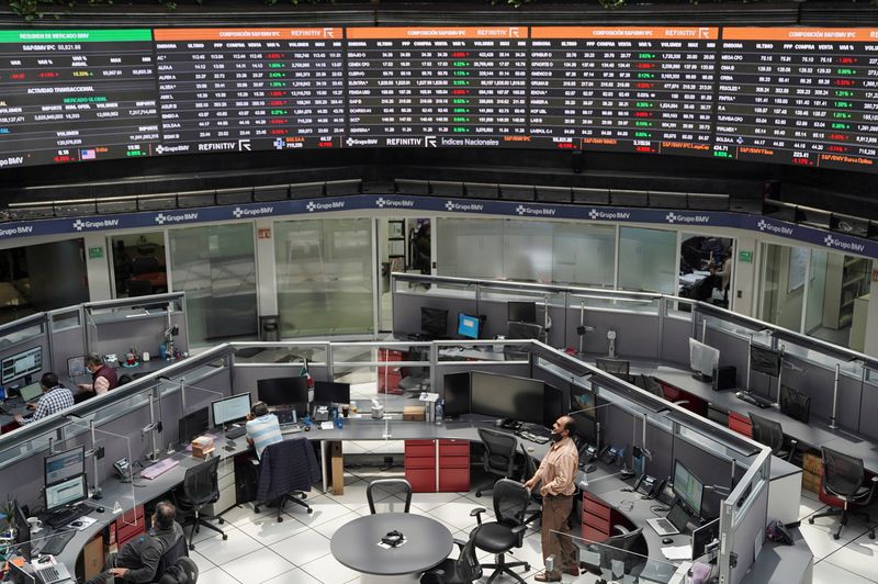 © Reuters. Employees work at their positions as a ticker displays stock exchange data at Mexico's stock exchange, in Mexico City, Mexico June 1, 2021. REUTERS/Toya Sardo Jordan