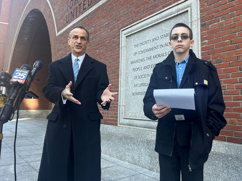 &copy; Reuters. FILE PHOTO: Lawyer David Cortman speaks with the media next to his client Liam Morrison, after arguments before a federal appeals court concerning a middle school's decision to not allow him to wear a t-shirt that says, "There are only two genders", in Bo